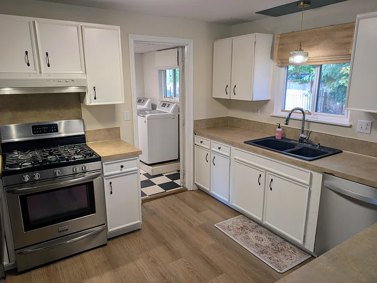 Kitchen leading to laundry