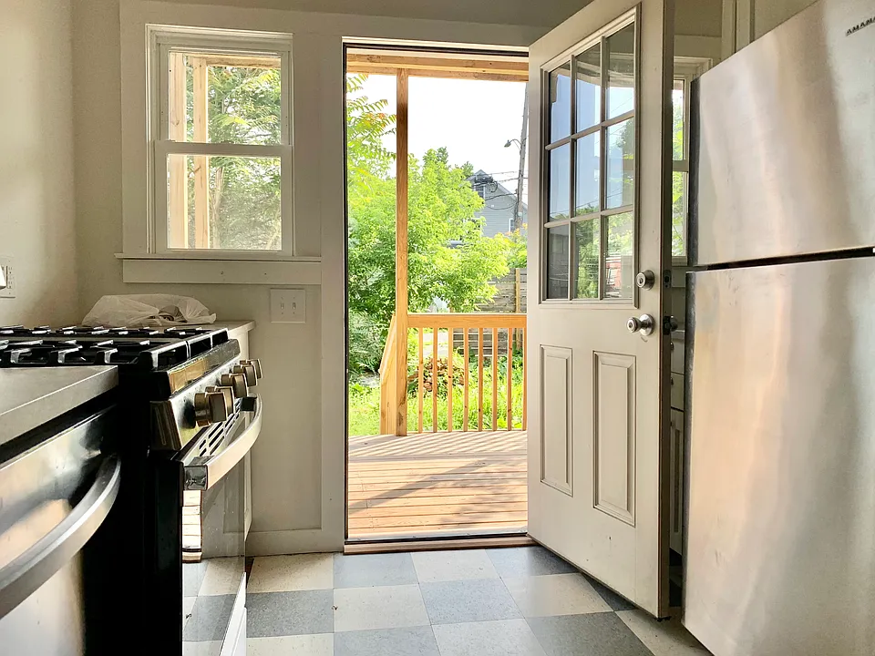 Kitchen looking on to back porch and private garden.