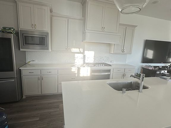 Kitchen with Refrigerator, Dishwasher, Microwave and Oven