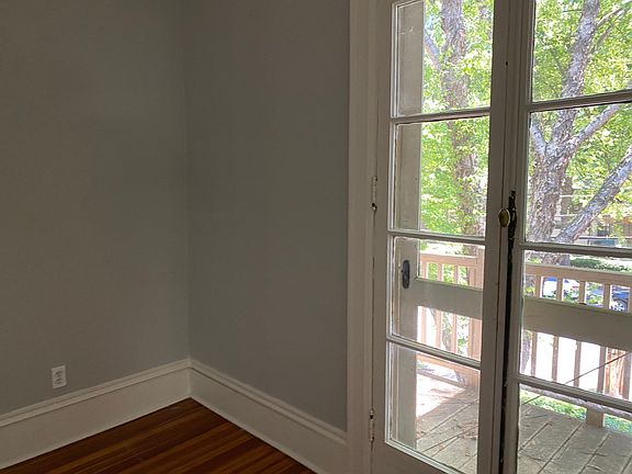 Opening glass doors and balcony, outside/attached to office facing Myrtle St.