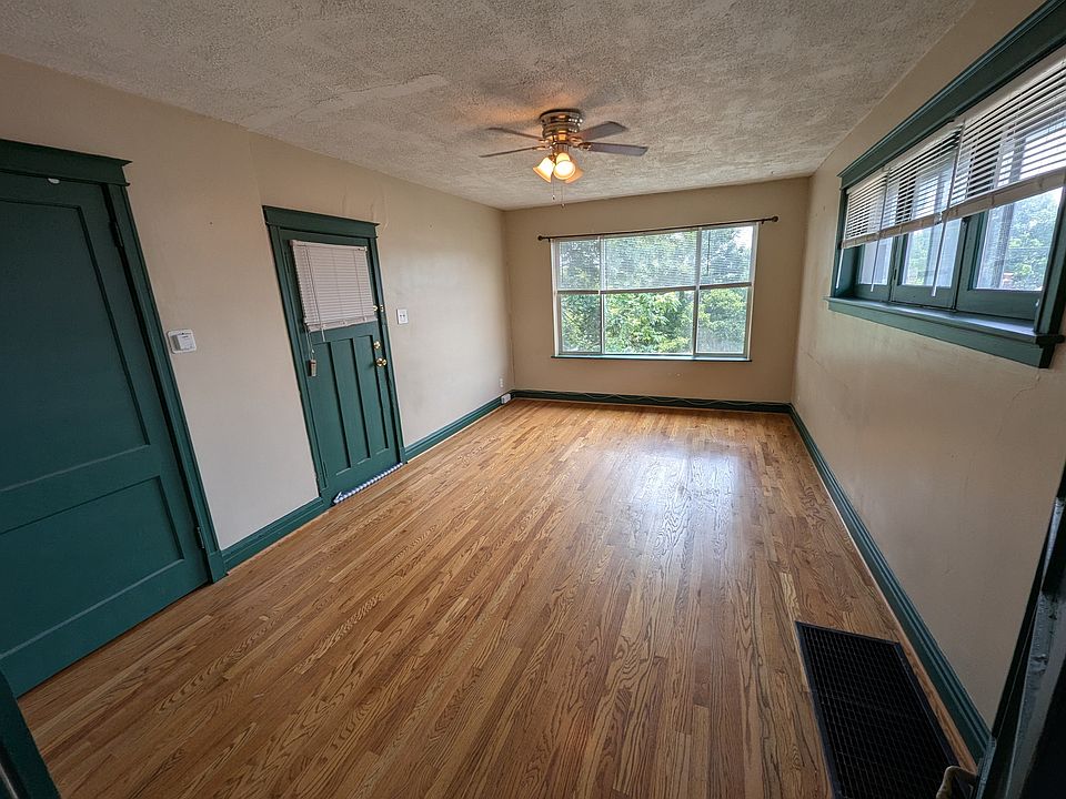 Spacious Living Room/Dining Room Gorgeous Refinished Hardwood Floors & Brand New Windows Throughout!