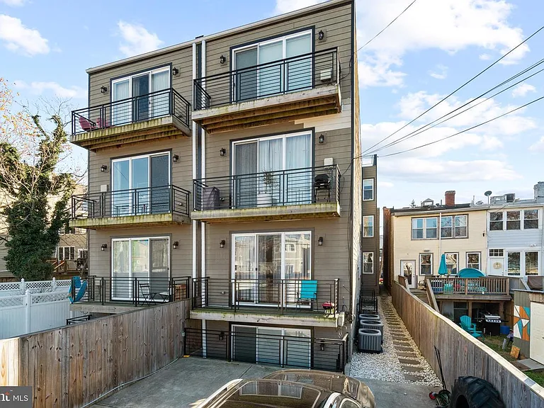 Unit 2 balcony is the one with the blue chair.