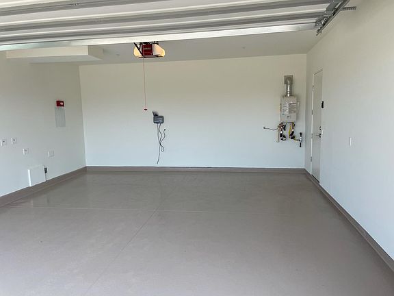 Immaculate 2 car garage, tankless water heater.