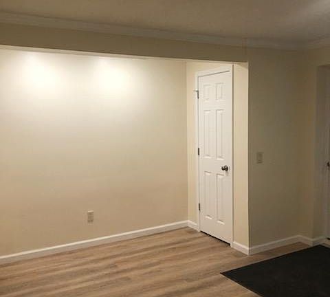 Living room with coat closet.