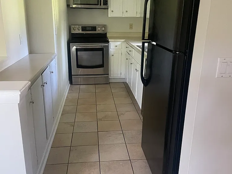 Kitchen has extra cabinet space for storage