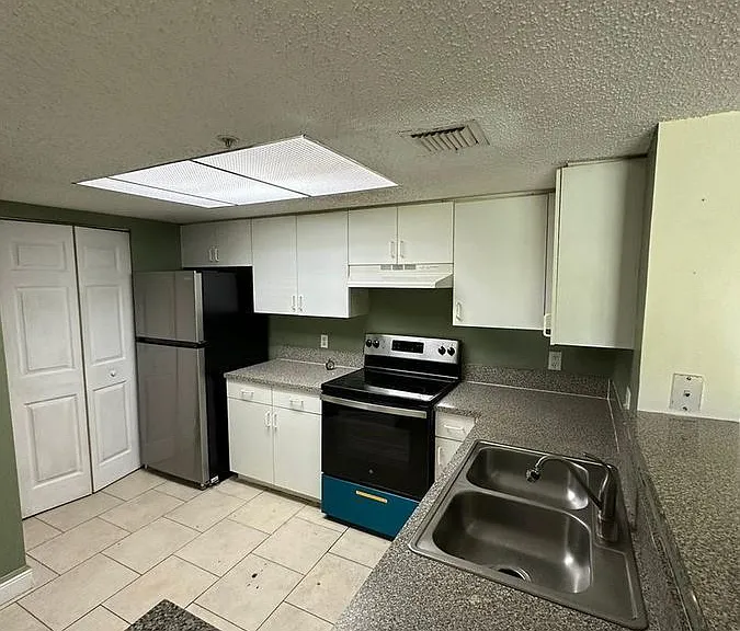 5005 Wiles Rd #102 — Photo 41