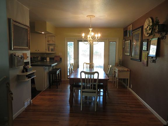 Looking through dining room to French doors to backyard