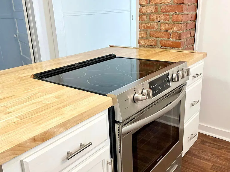 Kitchen island/bar, new range.