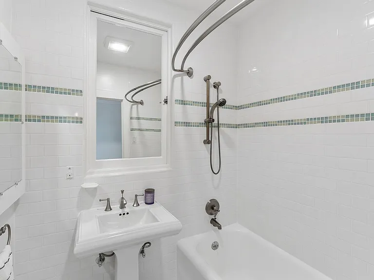 Upstairs bathroom with bathtub