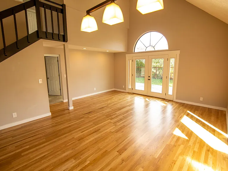 Large, vaulted ceilings look onto the combo living/dining room (view from the kitchen), and out to the back yard. Light and bright!