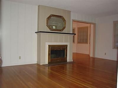 Cozy Fireplace in Living room with Orginial Hardwood floors