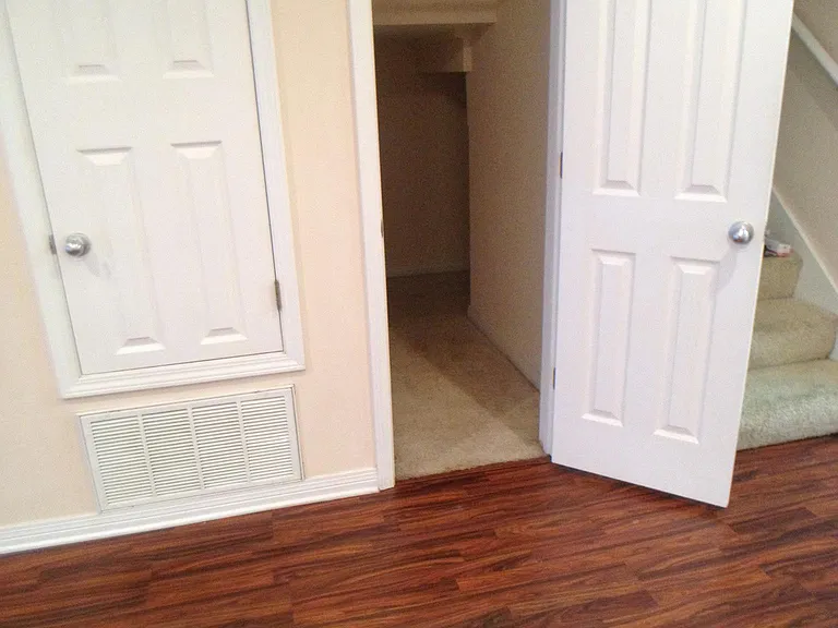 This picture is of a small storage area in the Living room area. The other door is the air conditioning closet.