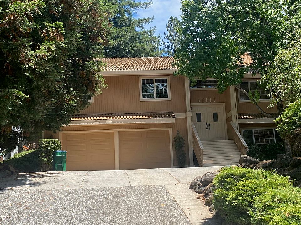 Front driveway and house with 2 car garage and enough for 4 additional parking spots