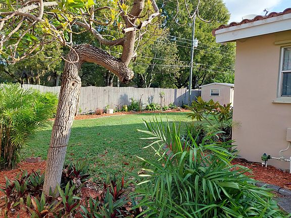 Back yard with a storage shed. Back yard is completely fenced in. Back yard backs up to Norwood Park. (tennis courts, playground, walking path, picnic area)