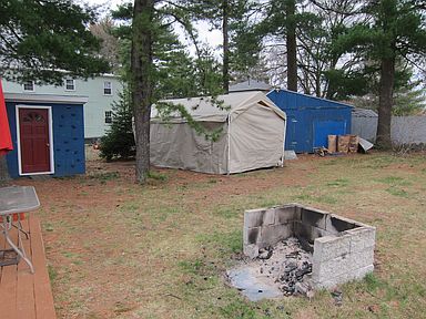 With two sheds and a fire pit, who needs a house??