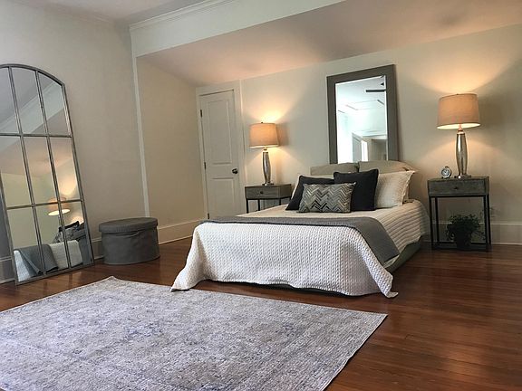 large bedroom with lots of light with oversized windows