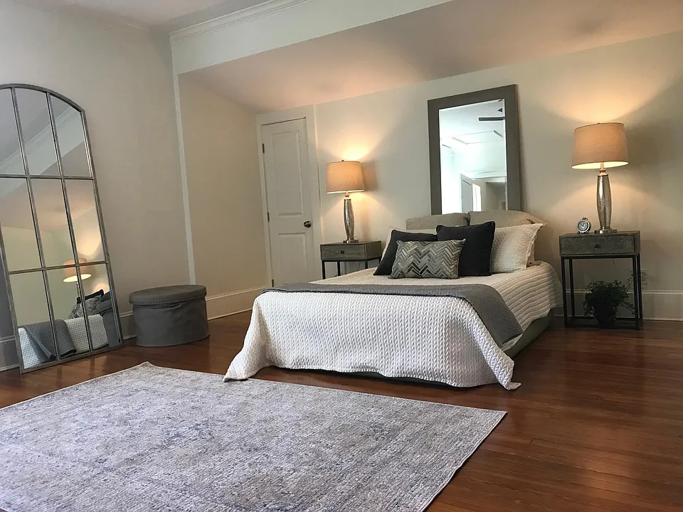large bedroom with lots of light with oversized windows