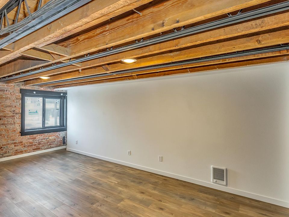 Bedroom one has exposed brick