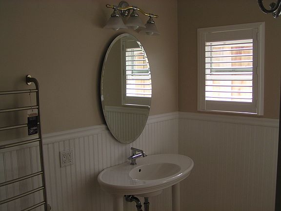 Bathroom vanity including towel warmer