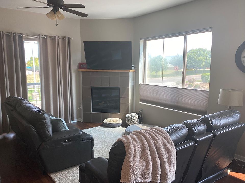 Living room with gas fireplace and access to front balcony