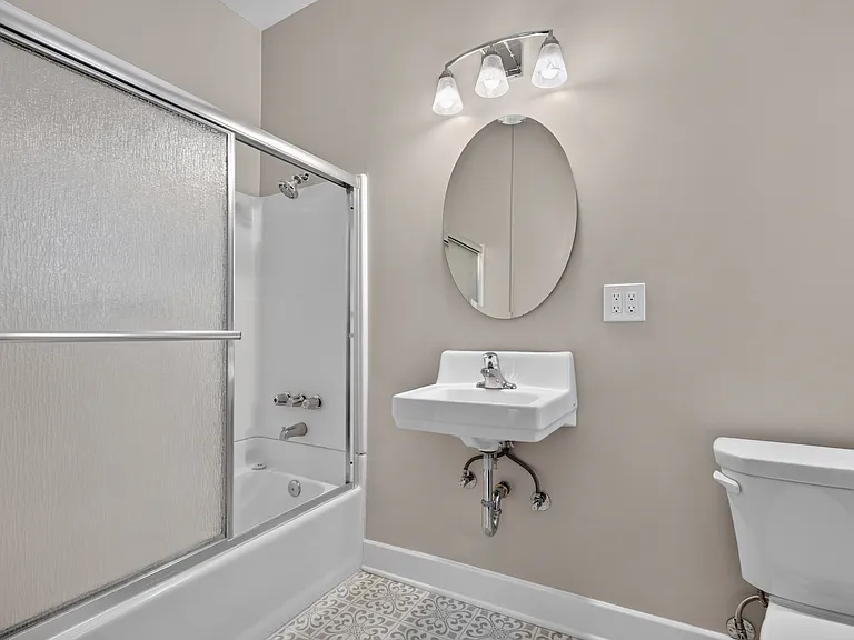 Bathroom with shower over tub