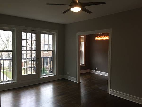 living room west view (camera over corrected for the sunshine. Please see other photos to see true wall/floor color)