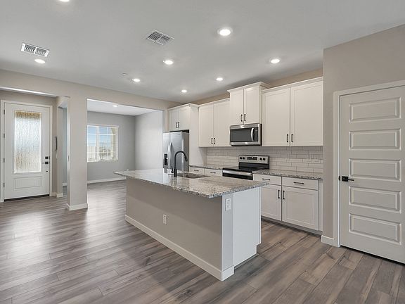 As you walk into the Bisbee, you are greeted by the stunning kitchen with designer finishes.