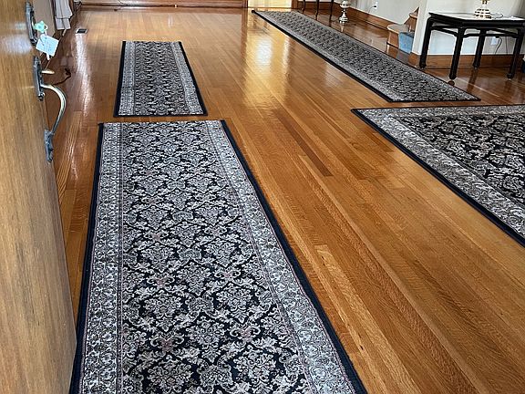 Living room leading into formal dining room and kitchen