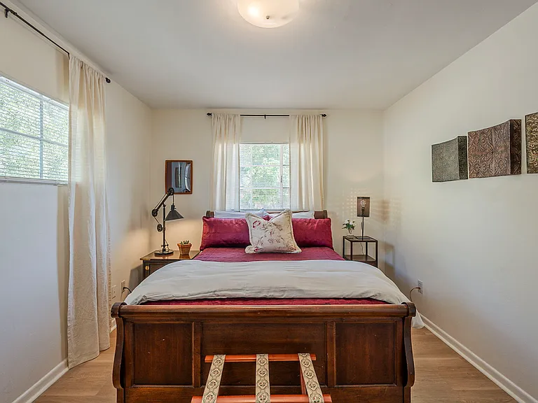 Peaceful second bedroom with natural lighting