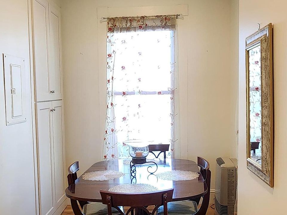 Dining Area With Lots of Built In Cabinets For Storage Of Kitchen Items