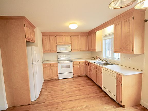 Fully applianced spacious kitchen with laundry area located on first floor as well.