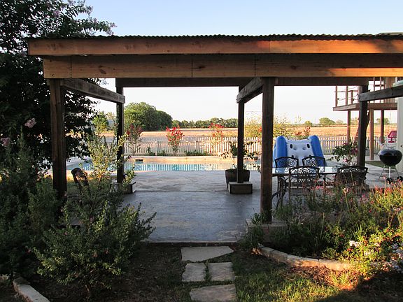 Picture perfect backyard with patio, inground pool, kids pla