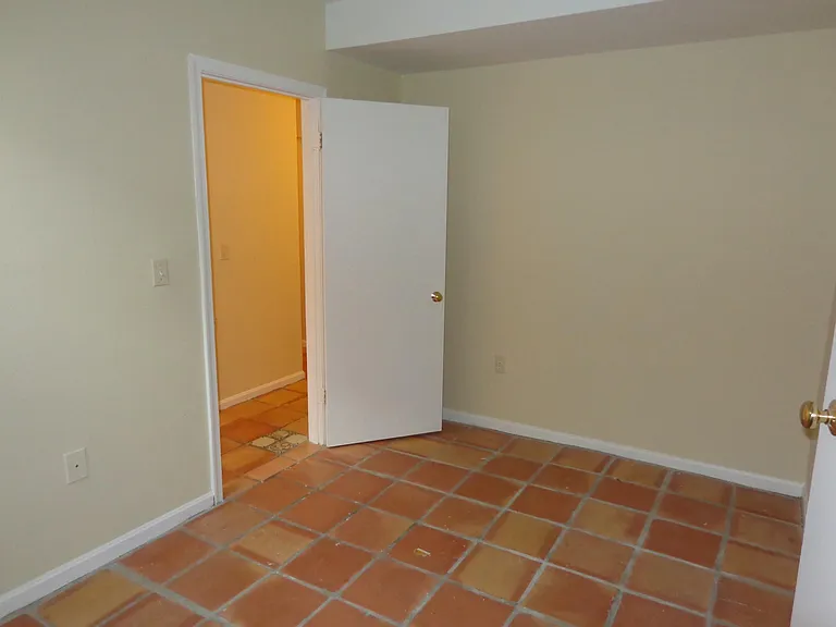 Basement storage/playroom/office with south-facing window.