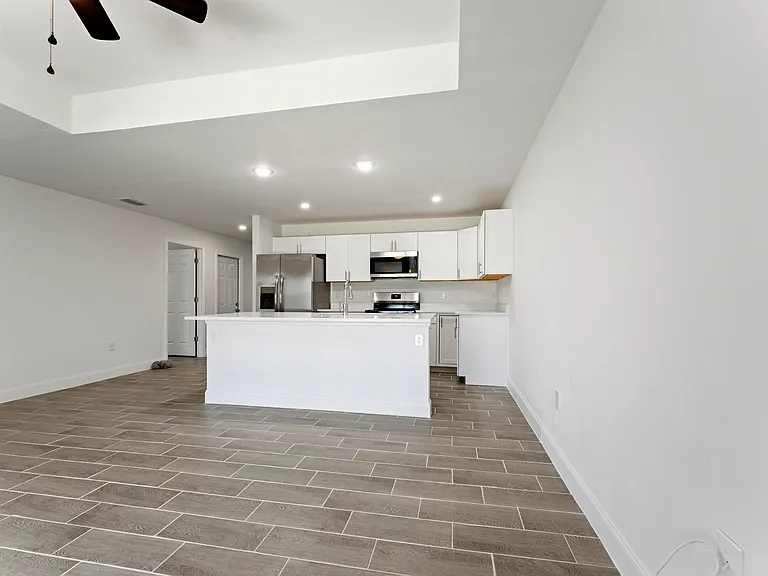 Fully upgraded kitchen with stainless steel appliances and spacious island.