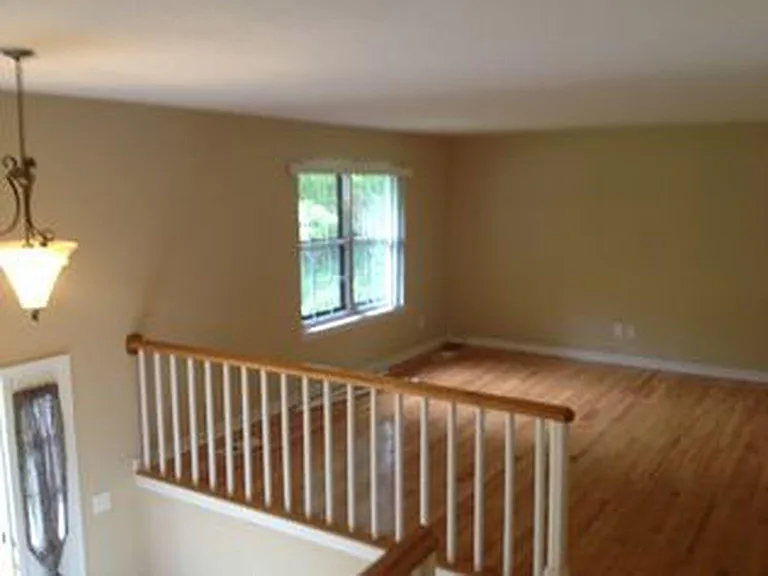 Upstairs living room adjacent to formal dining room.