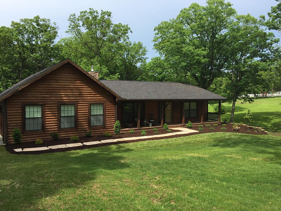 Stunning log cabin home sits on over 3 acres!