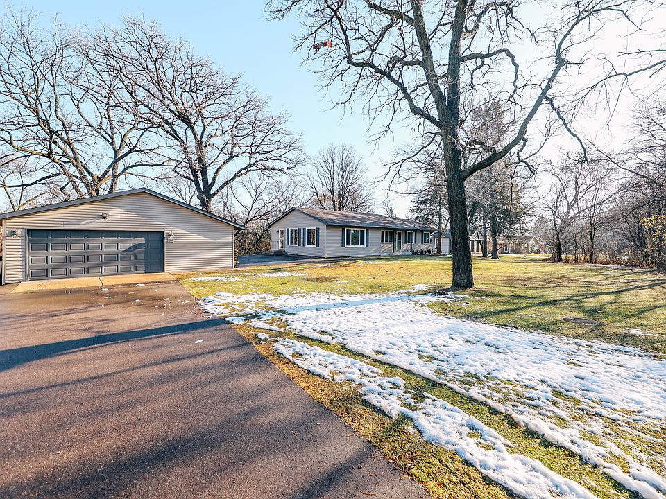 Driveway with large detached garage is great for storage.