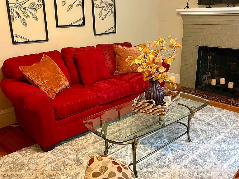 Comfy tastefully decorated living room with recliner and smart tv