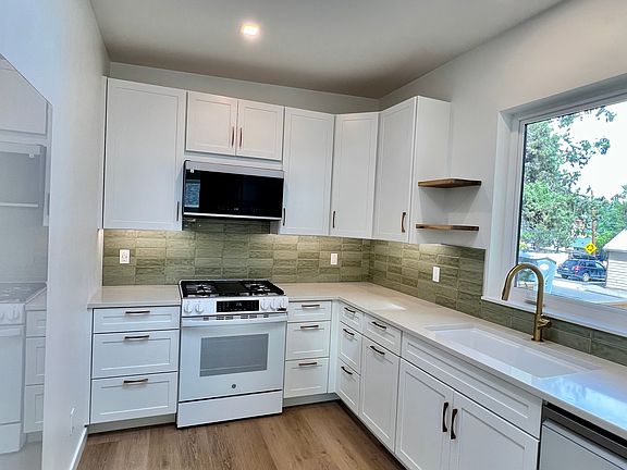 Kitchen with East facing window and skylight for lots of light.