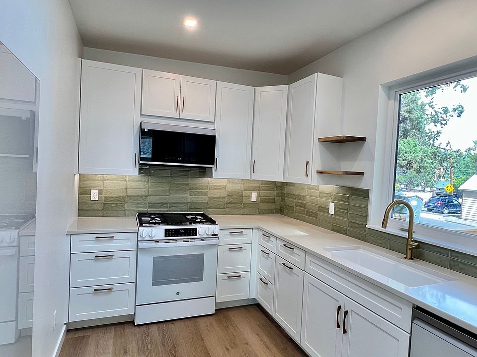 Kitchen with East facing window and skylight for lots of light.
