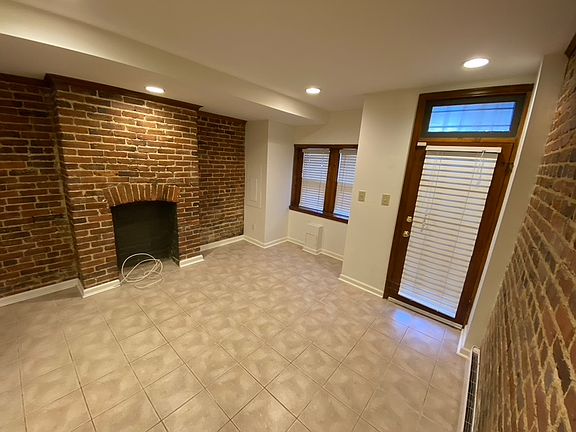 Front sitting area with exposed brick.