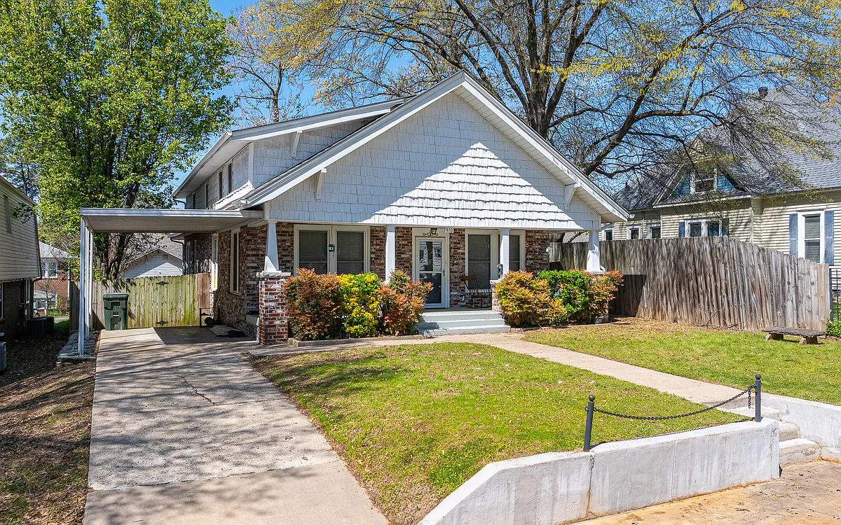Covered parking for 1 vehicle, additional parking space for 3 more vehicles in the driveway or parking pad in front of the house. - 910 S 25th St