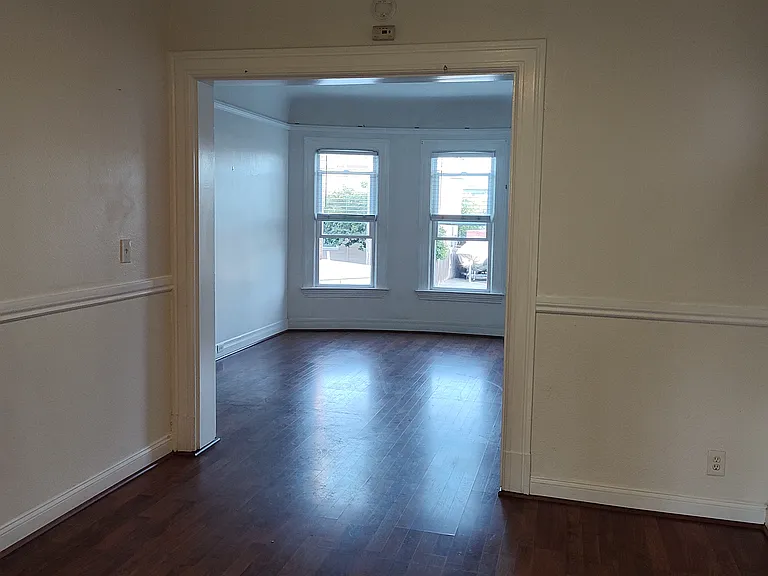 standing in the kitchen doorway looking towards the dining room and livingroom