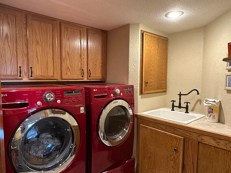 Laundry room with lots of storage and big sink