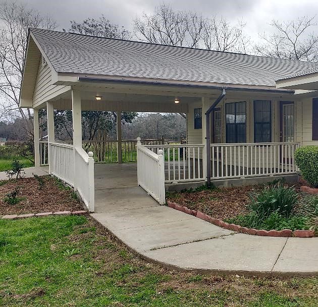 Front of Apartment with parking carport.