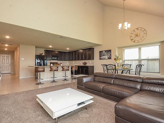 High Vaulted Ceilings adds to the charm of this popular open concept floor plan!