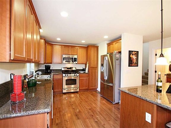 Gorgeous Stainless, Granite and Hardwood Kitchen
