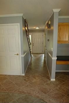 All entrances into the home are tile surfaces, easy to clean and maintain. All doors have some type 