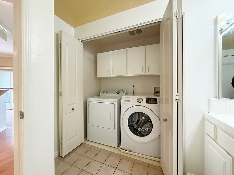 Inside unit Washer and Dryer in the hall bathroom