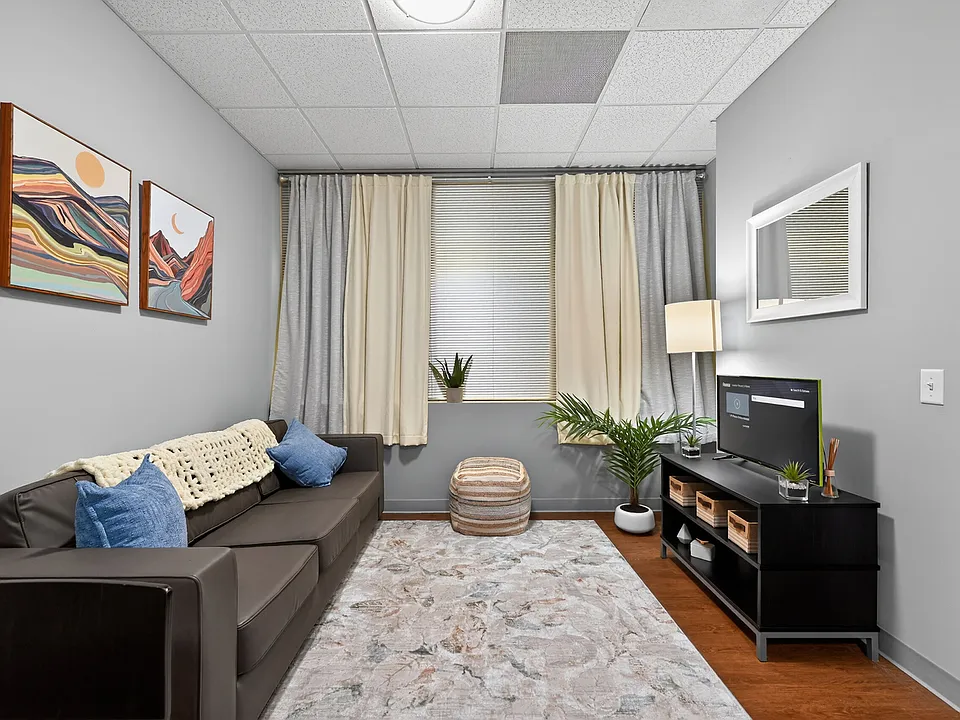 Bright Living Room with Natural Light at University Plaza NIU Off-Campus Apartments
